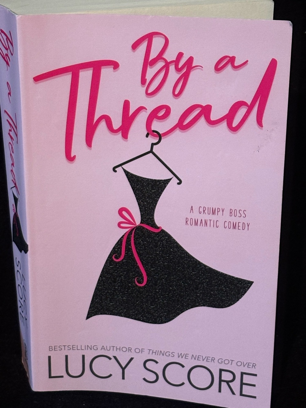By a Thread - Pink Cover Romantic Comedy by Lucy Score